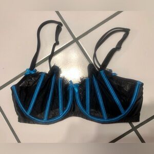 Ladies size 38DDD CACIQUE bra on sheer black eyelash lace and bright blue satin